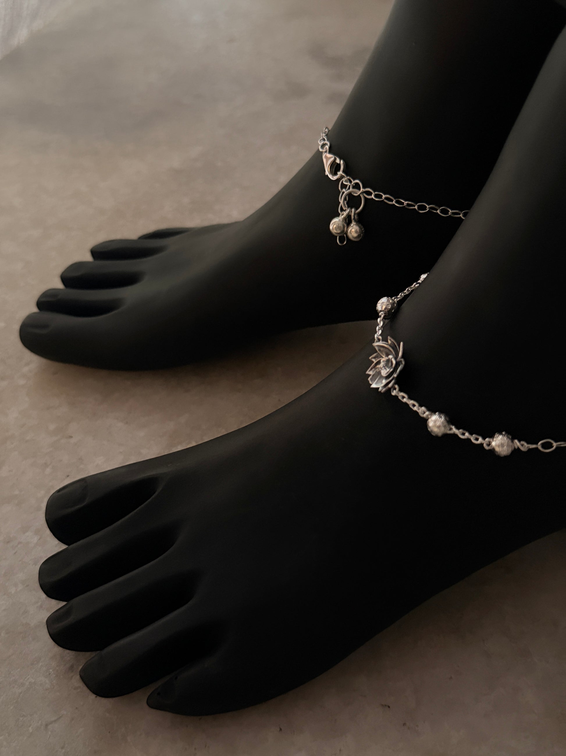 Delicate silver anklet featuring a divine lotus motif 