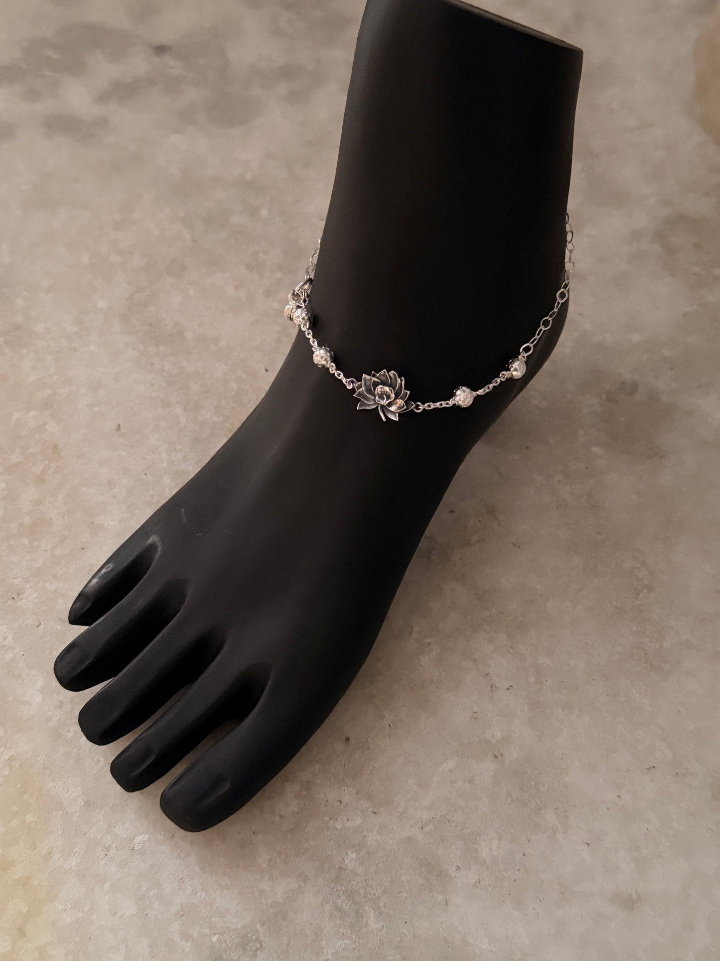Symbolic lotus flower anklet representing purity and grace