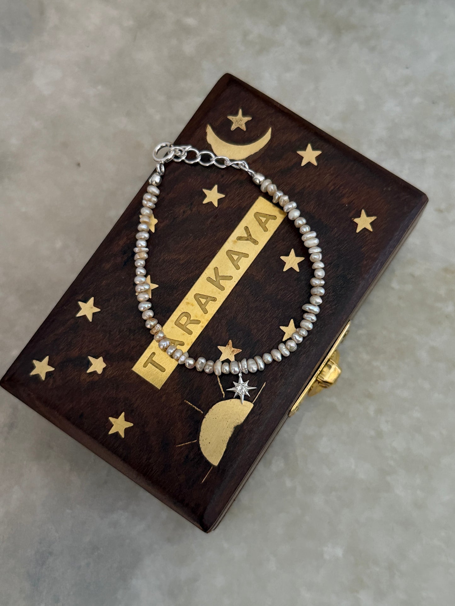 White topaz North Star charm bracelet with Basra pearls