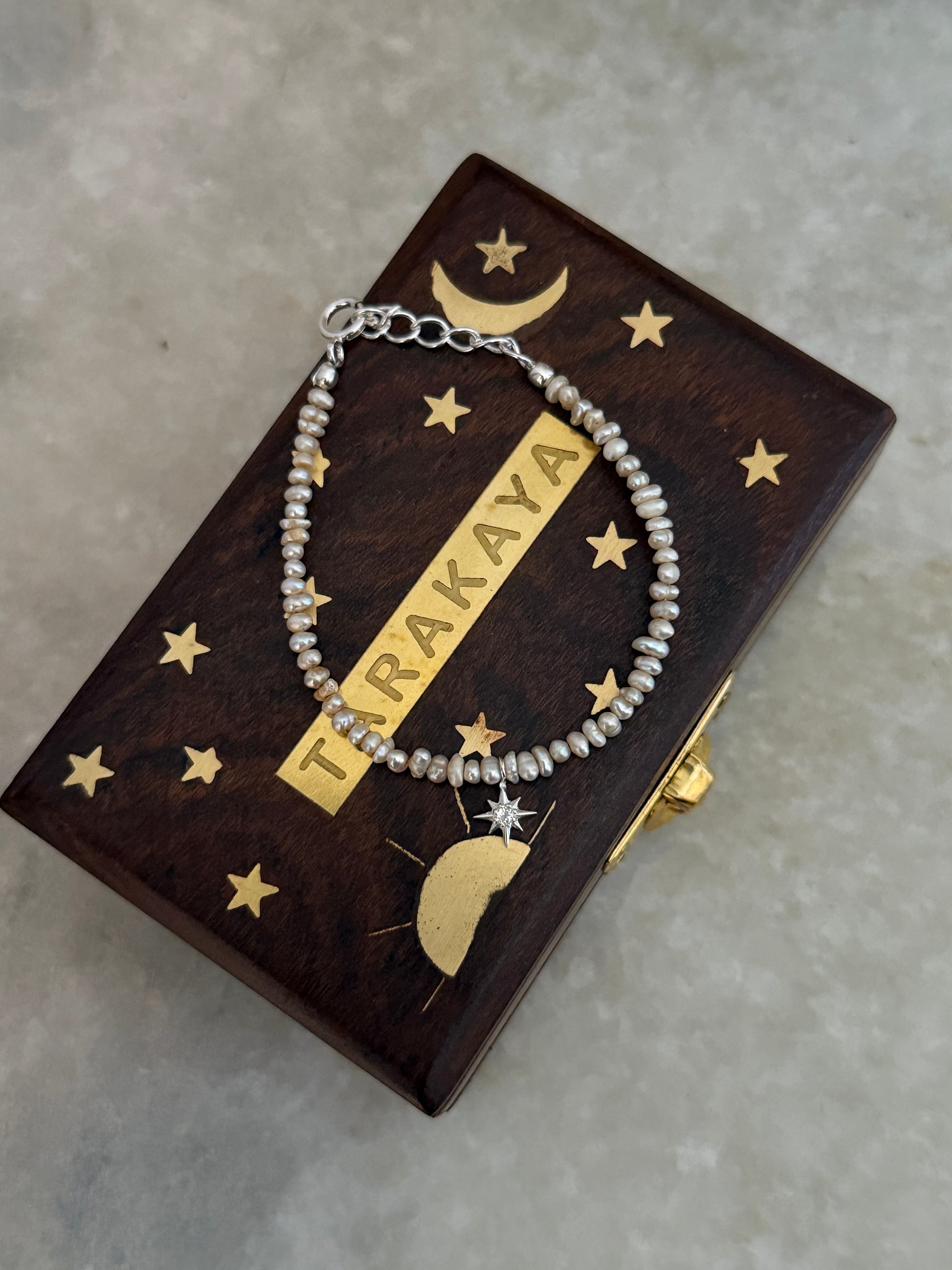 White topaz North Star charm bracelet with Basra pearls