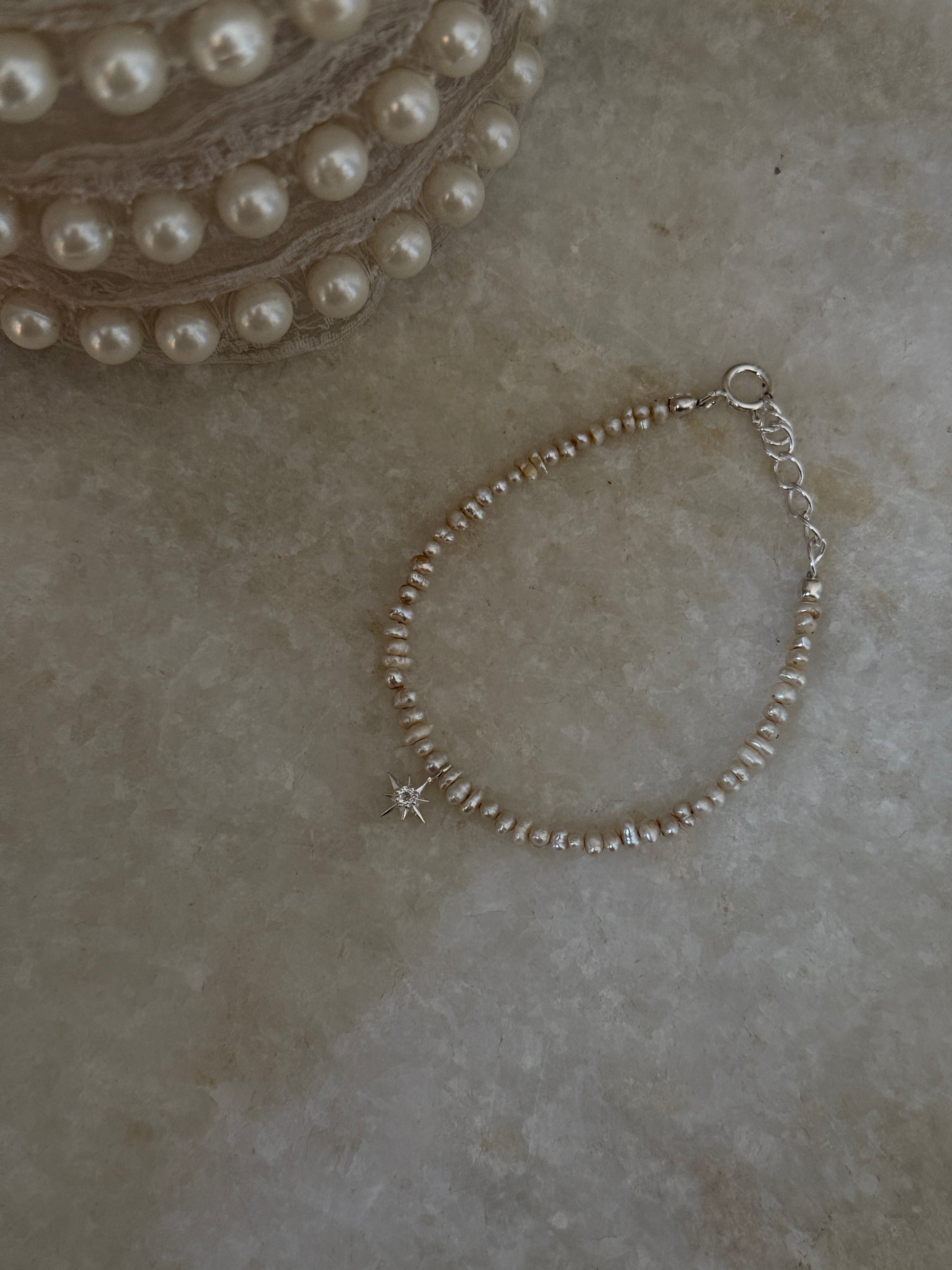 Natural Basra pearls with North Star white topaz in 925 silver