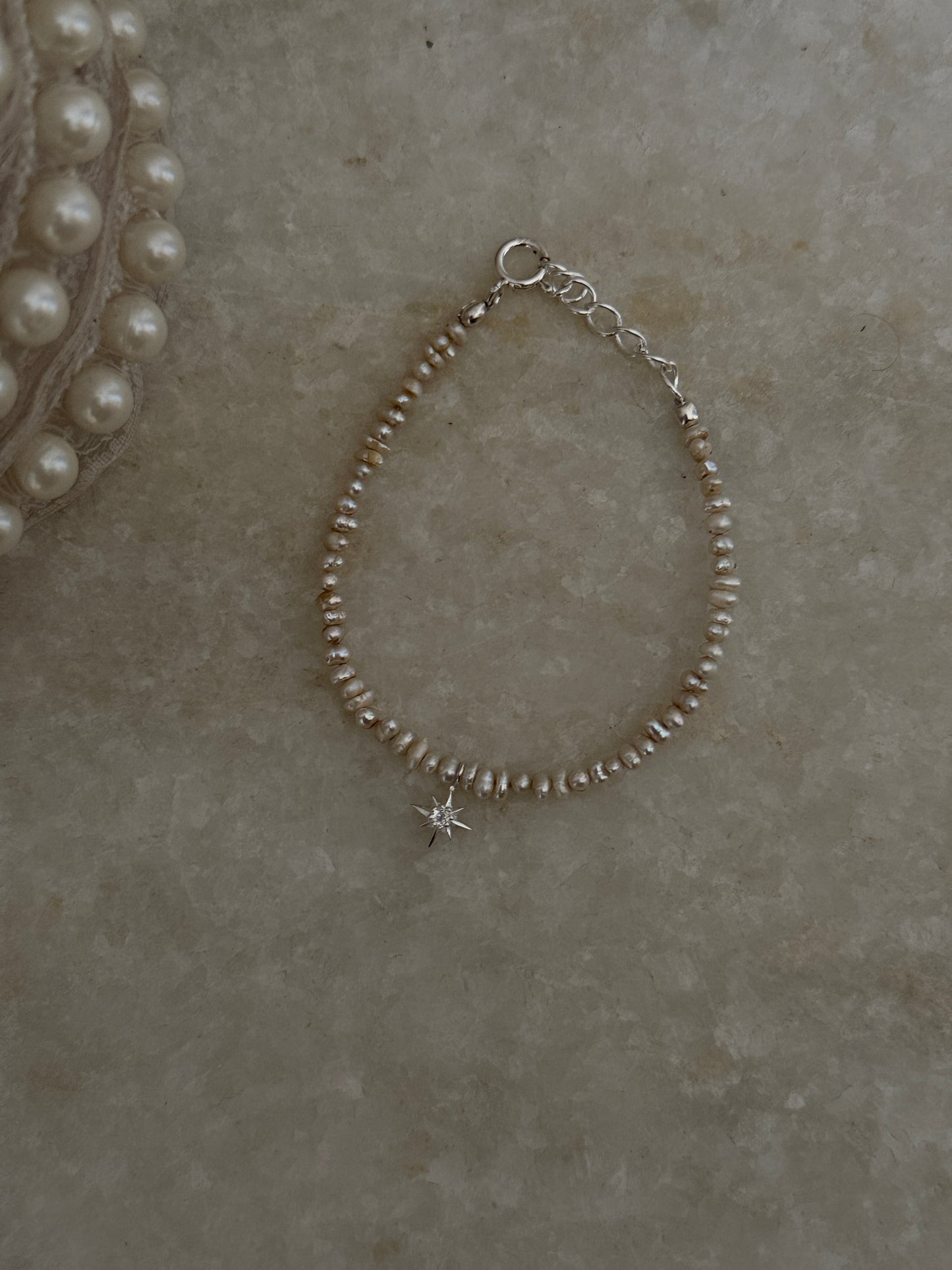 White topaz North Star charm bracelet with Basra pearls