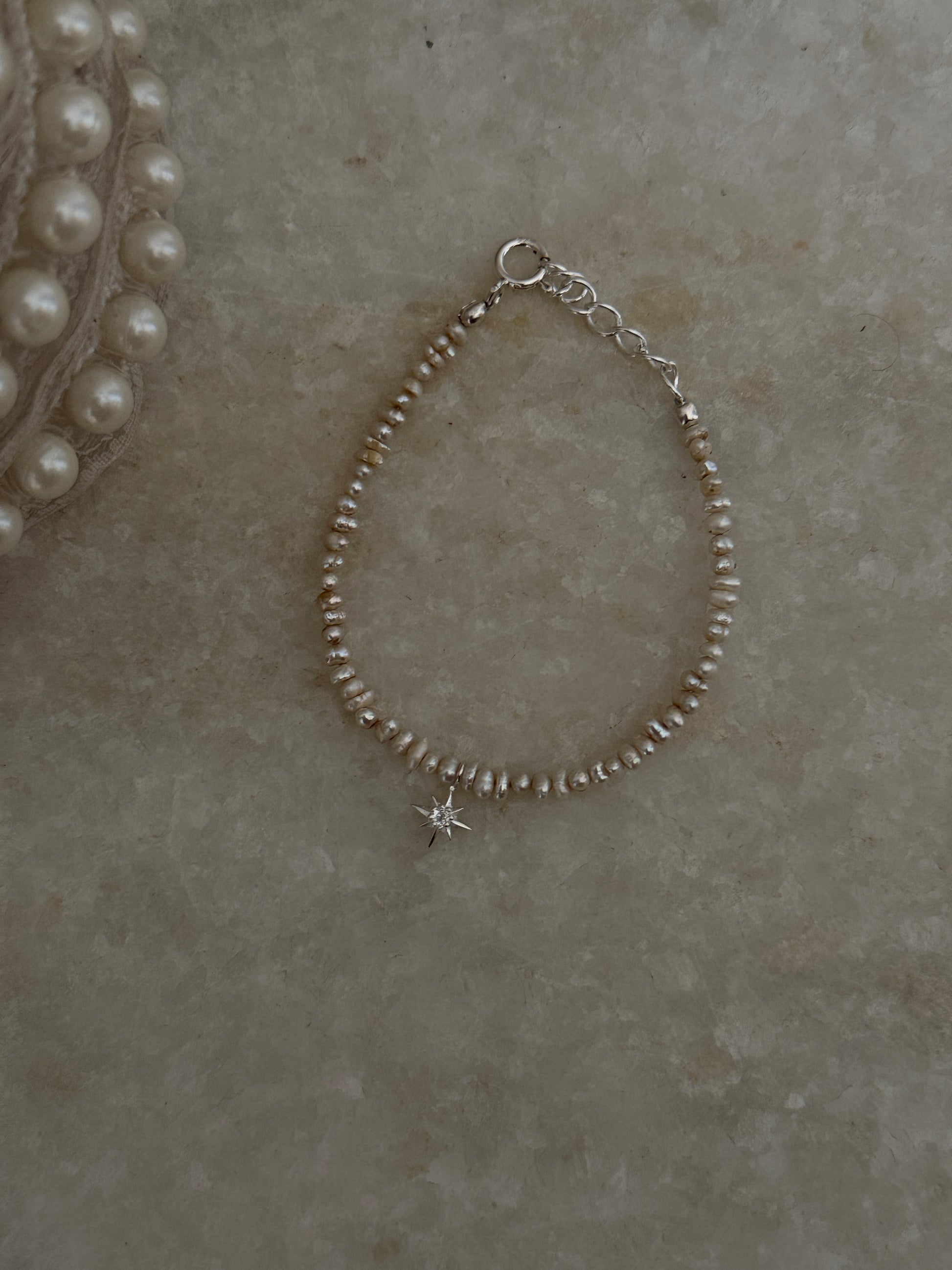 White topaz North Star charm bracelet with Basra pearls