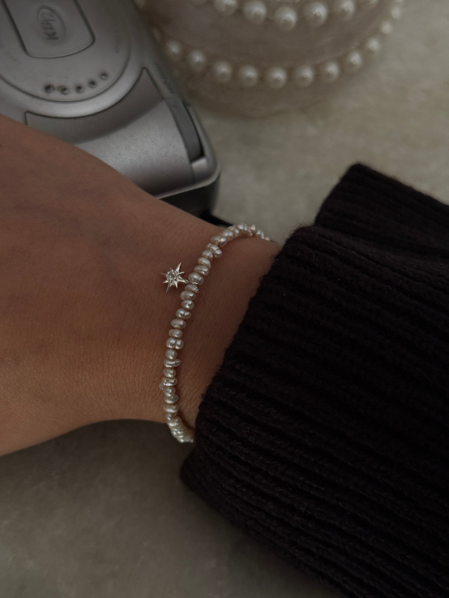 Elegant Basra pearl and white topaz North Star silver bracelet