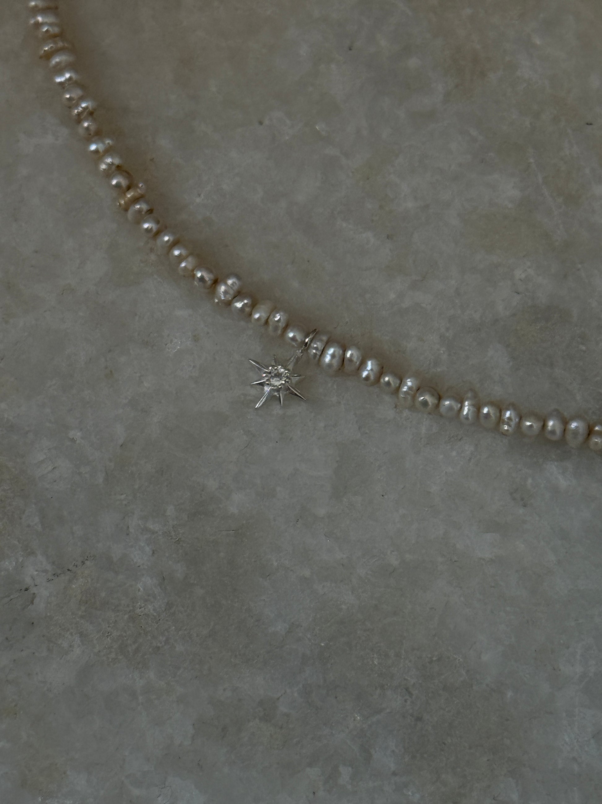 Fresh water pearl Basra bracelet with North Star white topaz charm