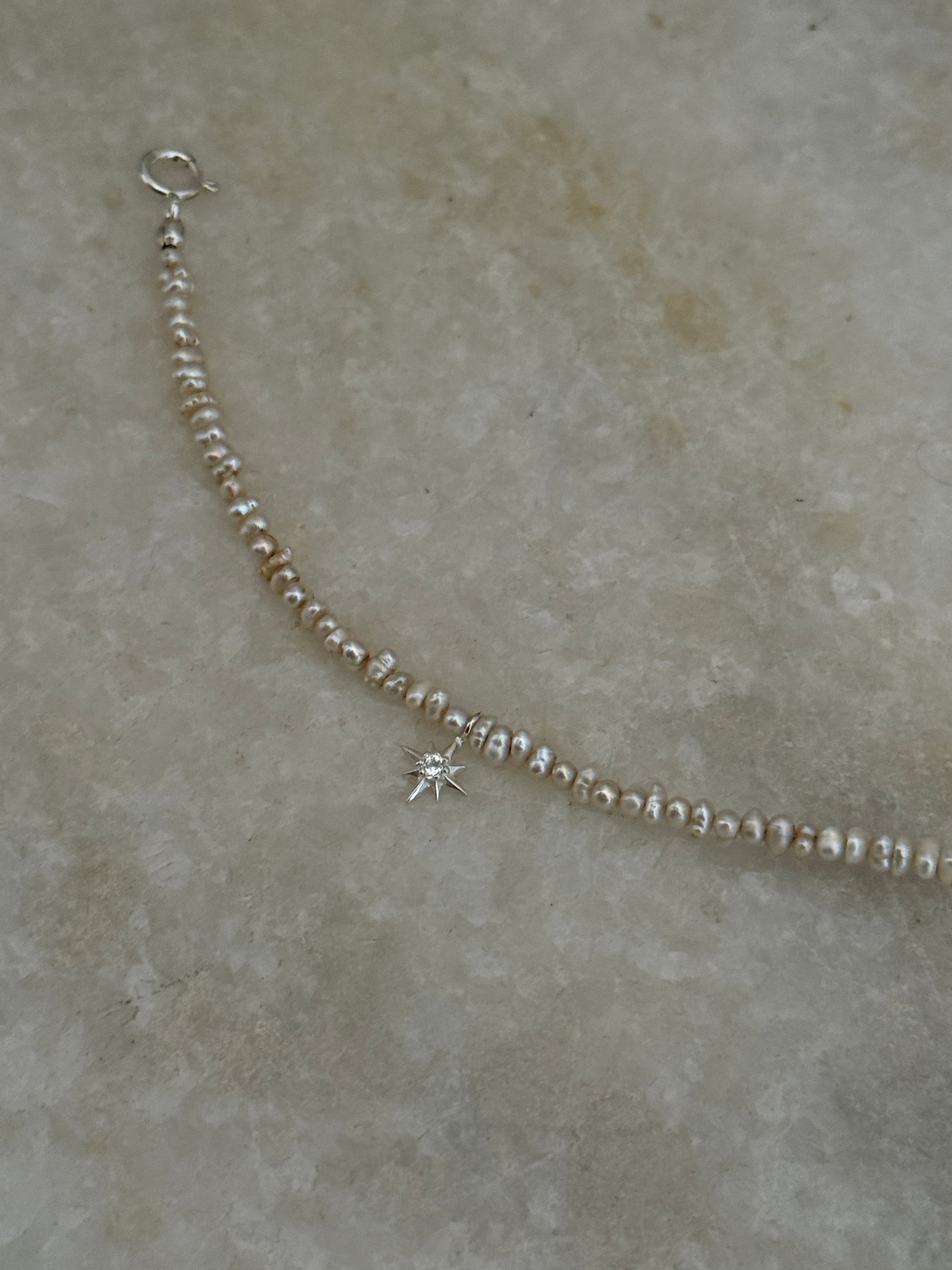 Natural Basra pearls with North Star white topaz in 925 silver