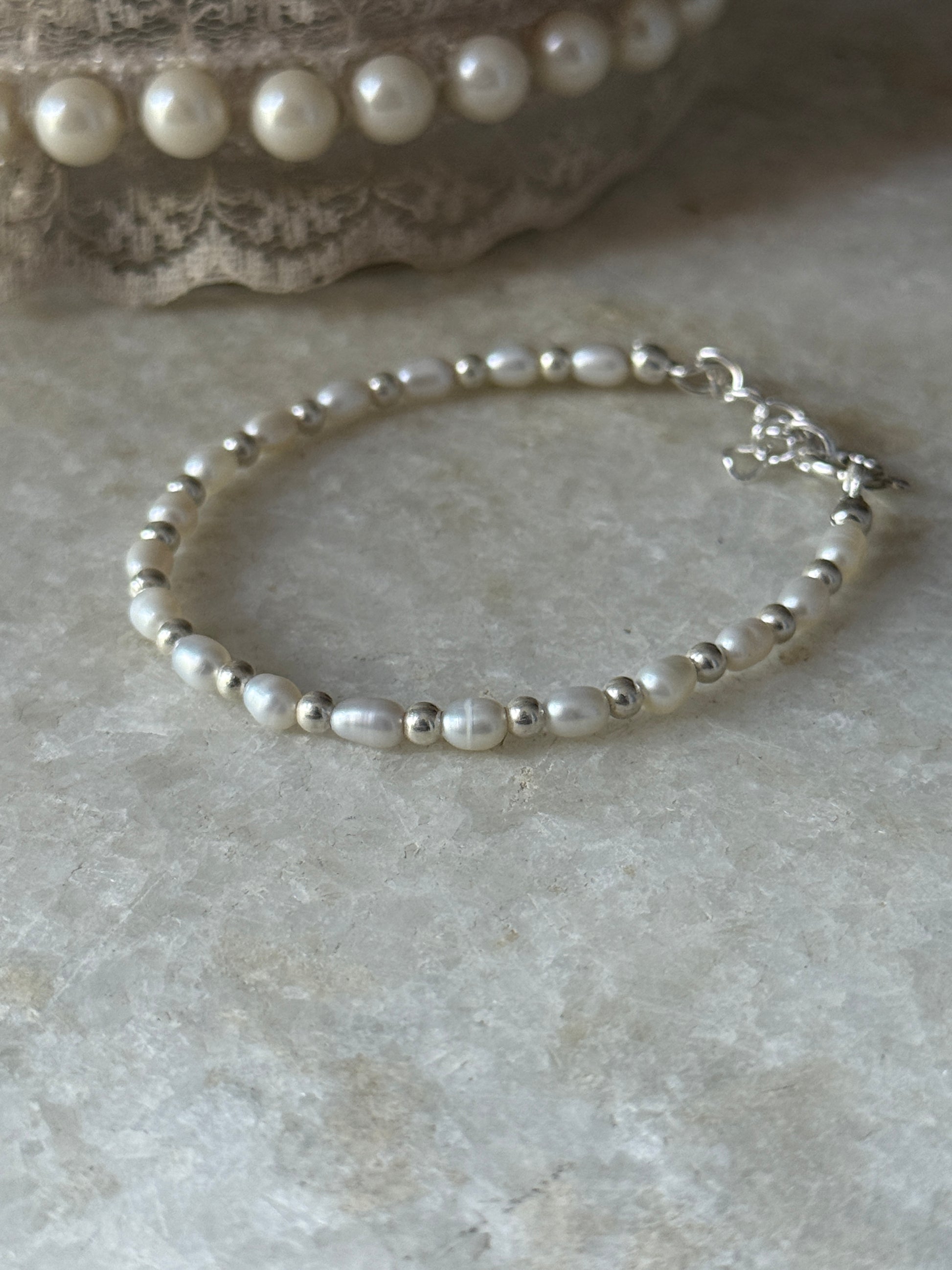 Dainty freshwater pearl and silver bead bracelet