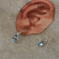 Pear-shaped blue topaz silver earrings in sterling silver