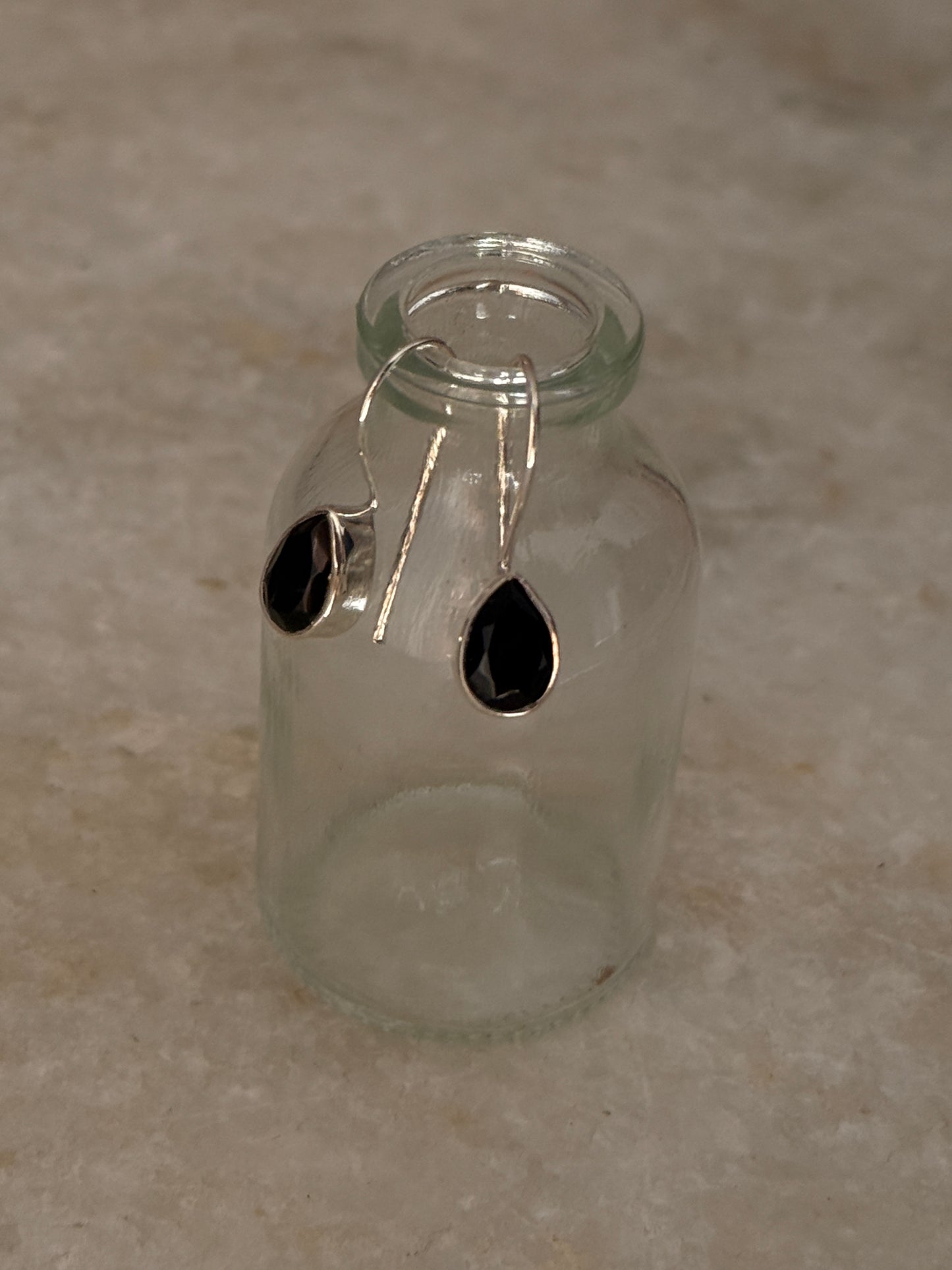 Pear-shaped black onyx hook earrings in sterling silver