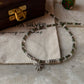 Artisan 925 sterling silver necklace featuring smokey quartz, emerald, and marijuana charm