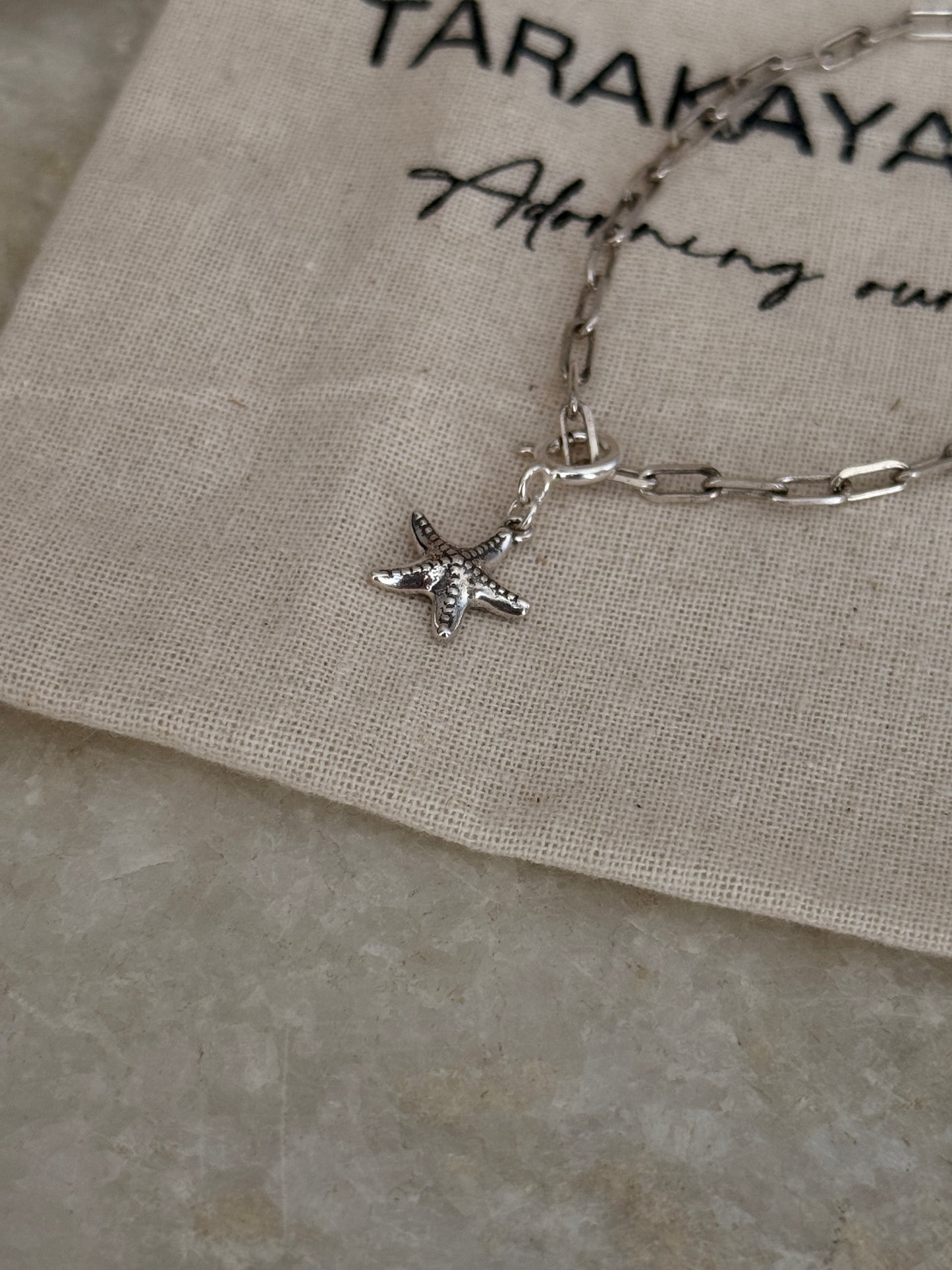 Ocean-inspired starfish charm bracelet in 925 sterling silver