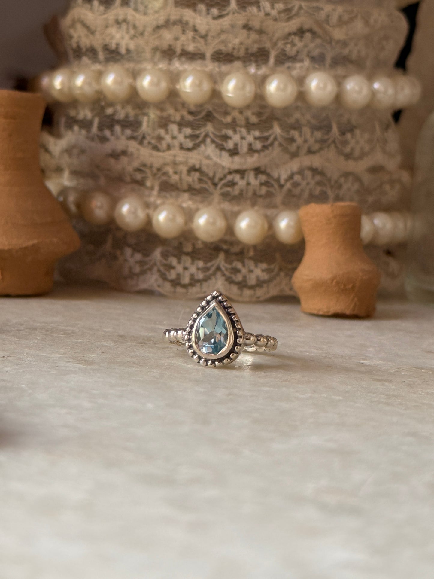 Blue topaz pear dot band ring in 925 sterling silver