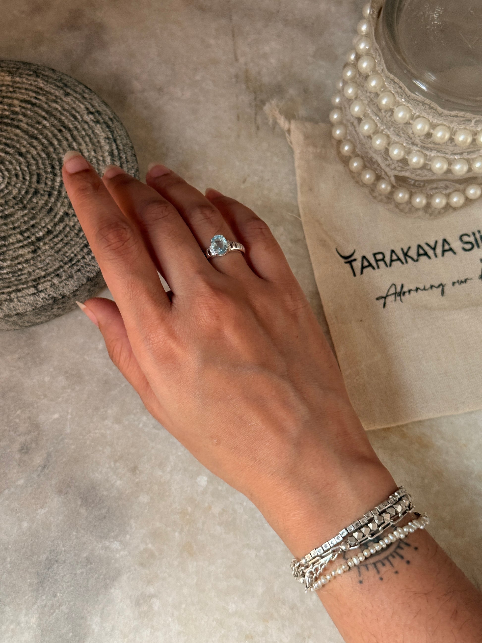 Artisan crafted blue topaz oval adjustable 925 sterling silver ring