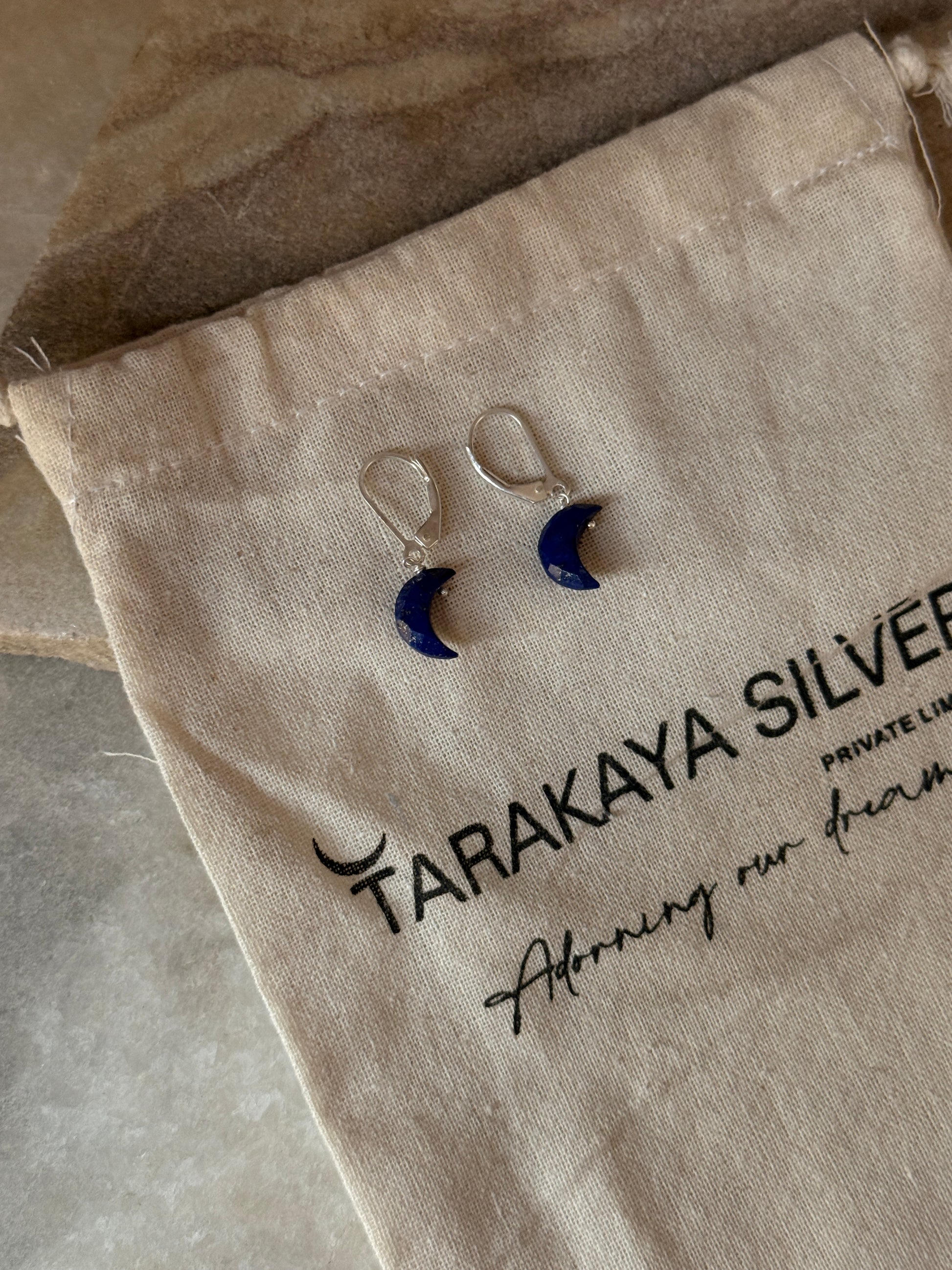 Handmade 925 sterling silver moon earrings featuring lapis lazuli stones