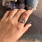 Silver garnet ring with a crown motif in boho style