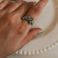 Unique fairy in the garden silver ring with fairy figure surrounded by flowers
