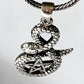 Sterling silver pendant featuring a snake and pentacle
