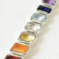 Elegant seven chakra rectangular cut statement pendant in silver