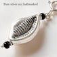Elegant silver pendant featuring a natural cowrie shell charm