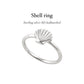 Elegant shell silver ring with intricate design