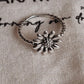Sleek daisy silver ring with smooth, refined band
