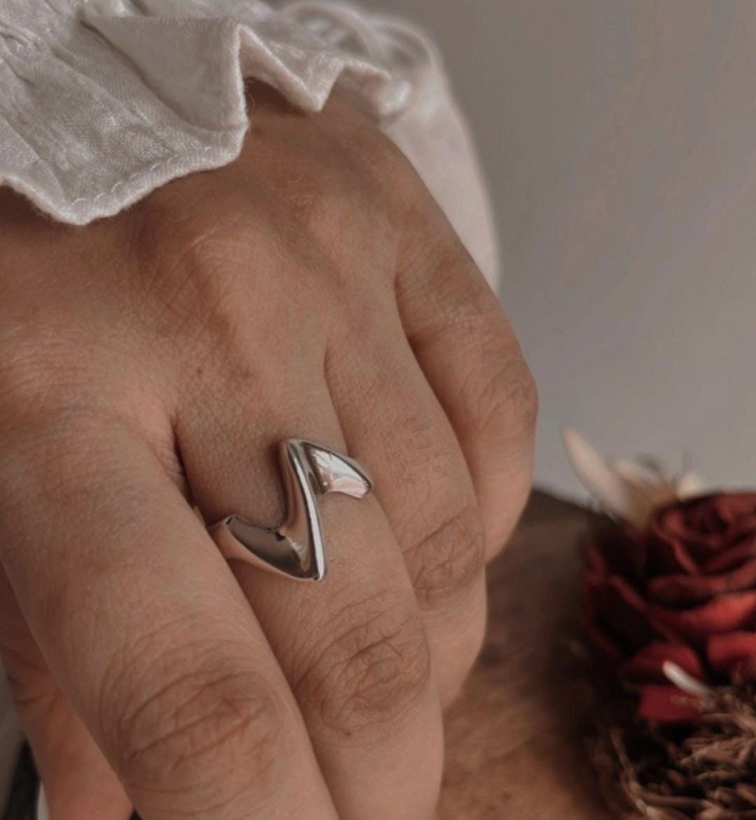 Modern abstract sculpture silver ring with artistic flair