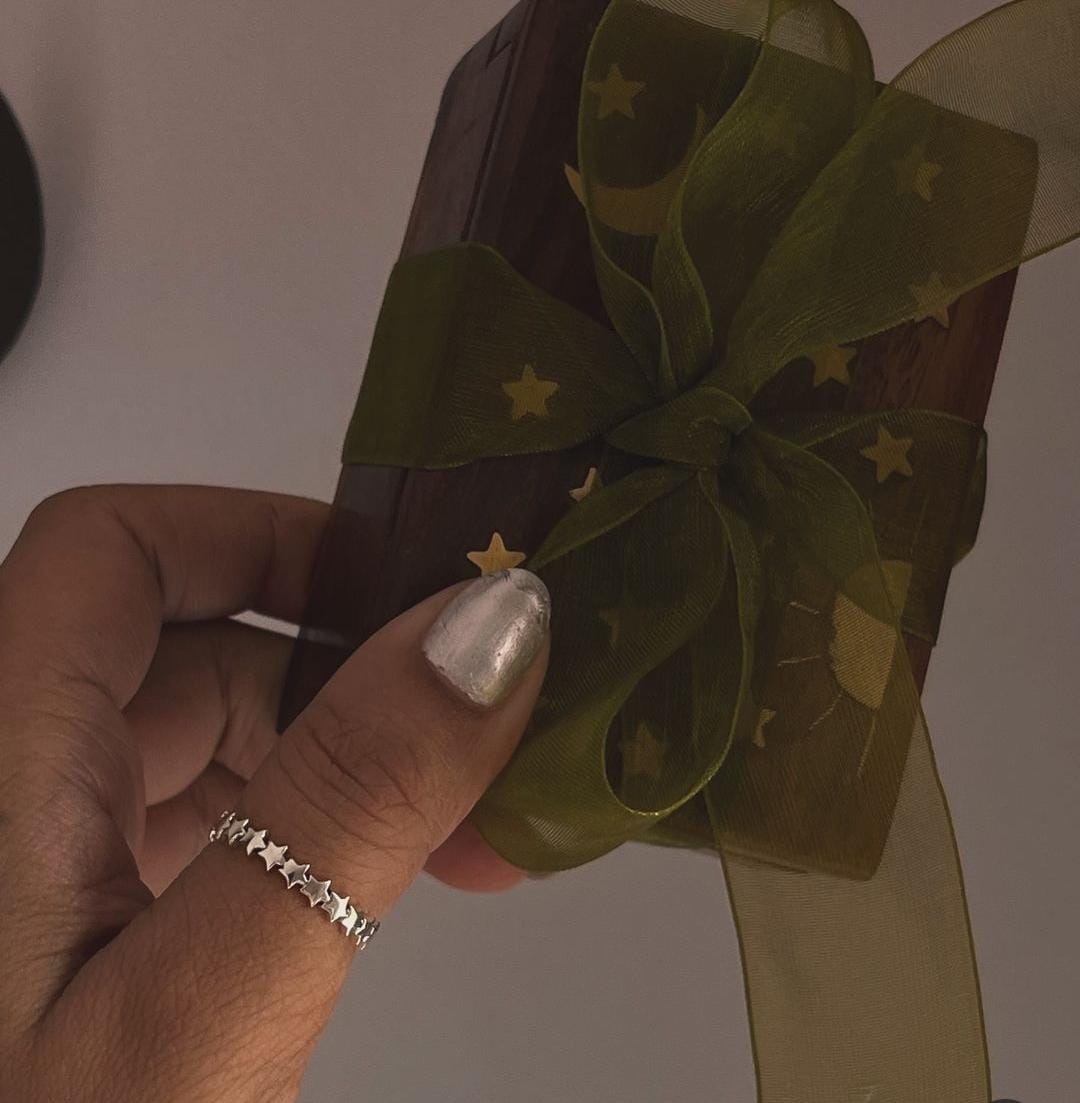 Minimalist silver band ring with small star accent