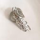 Sleek silver ring with a detailed Bali leaf pattern.