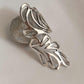 Timeless silver ring featuring a Bali leaf design.