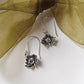 Delicate silver earrings with lotus flower design