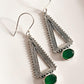 Green onyx triangle earrings with intricate tribal patterns