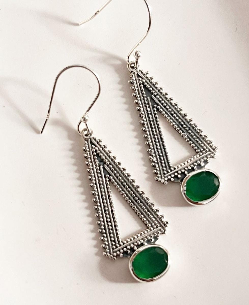 Green onyx triangle earrings with intricate tribal patterns