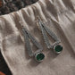 Green onyx triangular earrings in a tribal-inspired design