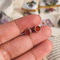 Close-up of 4mm carnelian tiny studs set in silver