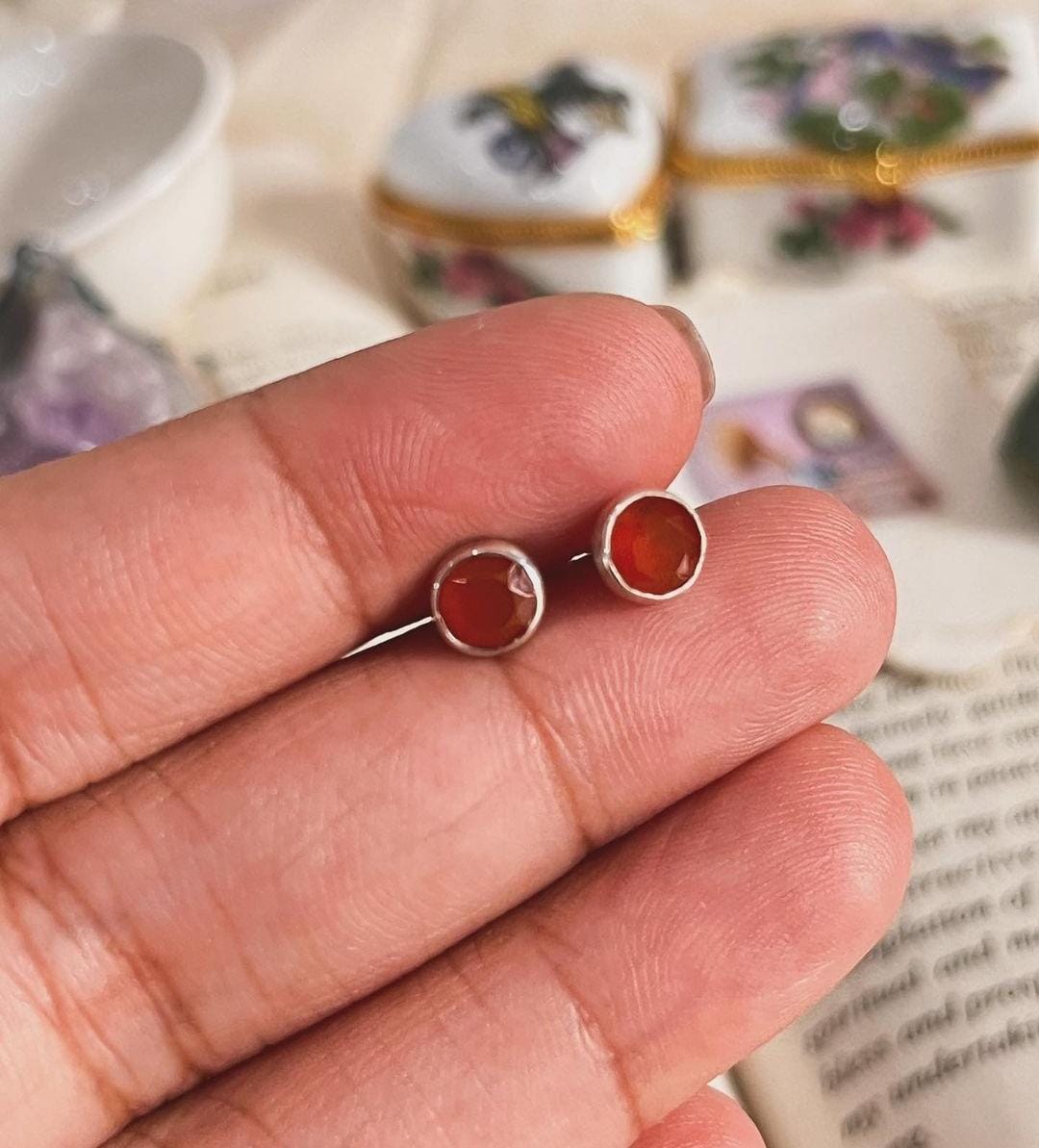 Close-up of 4mm carnelian tiny studs set in silver