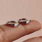 Delicate CZ silver huggie earrings with minimal design