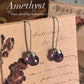 Sleek amethyst round cut hook 925 sterling silver earrings with a modern design.
