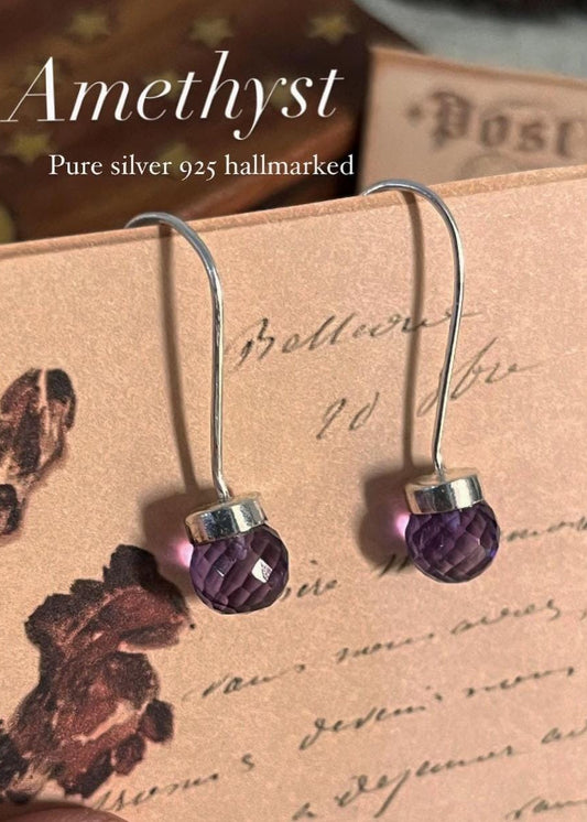 Sleek amethyst round cut hook 925 sterling silver earrings with a modern design.