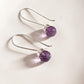 Elegant round cut amethyst hook earrings in 925 sterling silver.