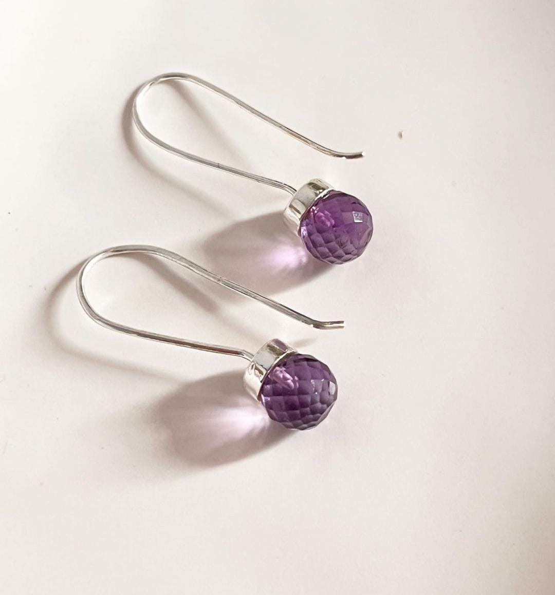 Elegant round cut amethyst hook earrings in 925 sterling silver.