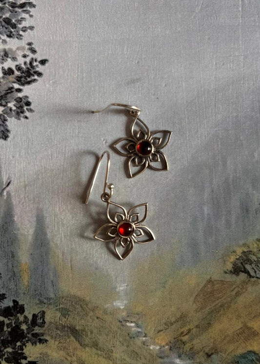 925 Sterling silver earrings shaped like flowers with garnet accents
