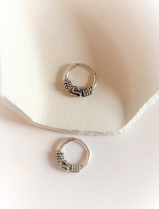 Elegant antique silver hoop earrings with intricate design 3.