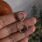 Vintage-inspired silver hoops featuring a detailed design 4.