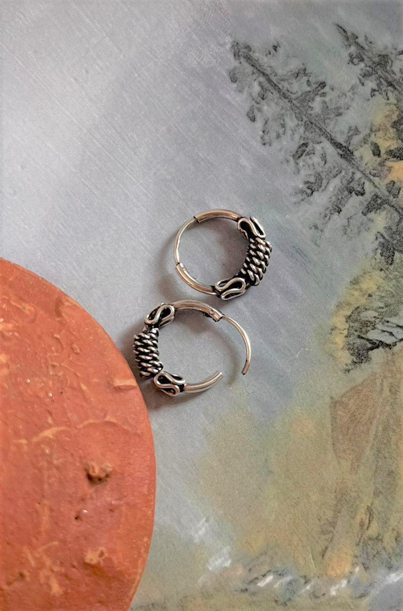 Elegant antique silver hoop earrings with intricate design 4.