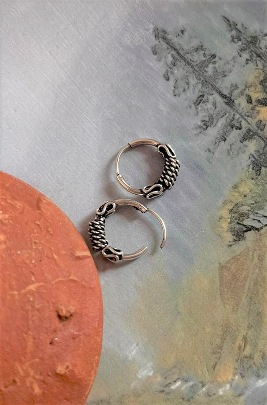 Elegant antique silver hoop earrings with intricate design 4.