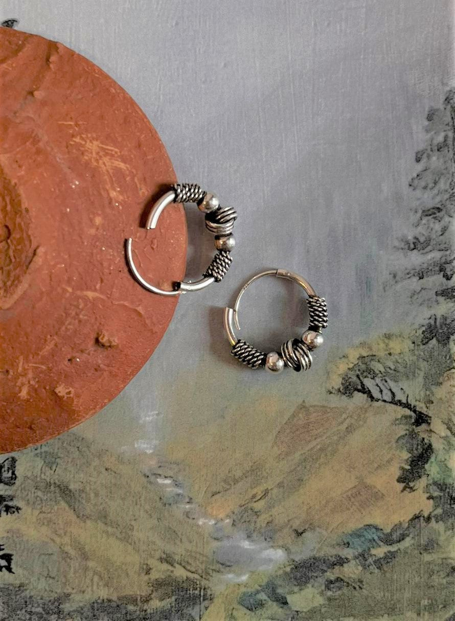 Antique silver hoops with design 8, offering a vintage yet chic style.