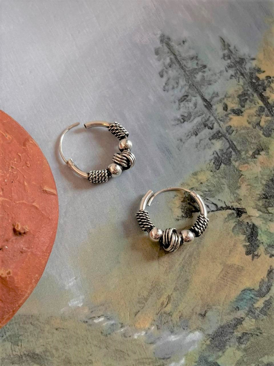 Timeless antique silver hoops with unique design 8 for a sophisticated look.