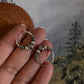 Vintage-inspired silver hoops featuring a detailed design 8.