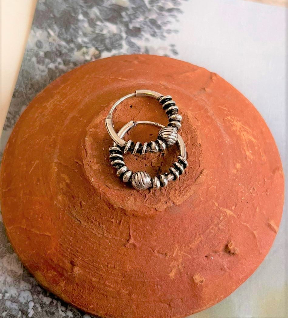 Handcrafted antique silver hoops with a beautifully detailed design 5.