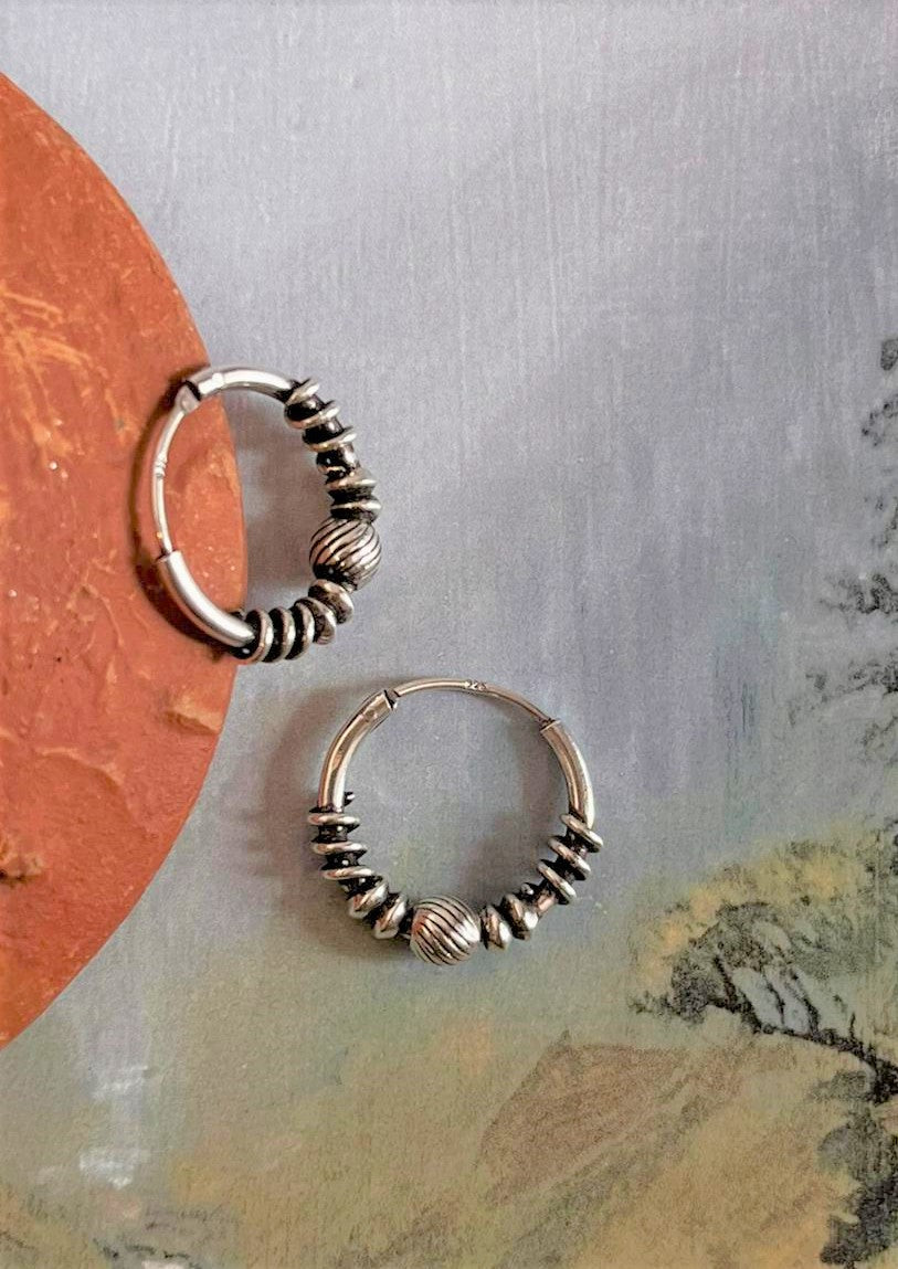 Timeless antique silver hoops with unique design 5 for a classic look.